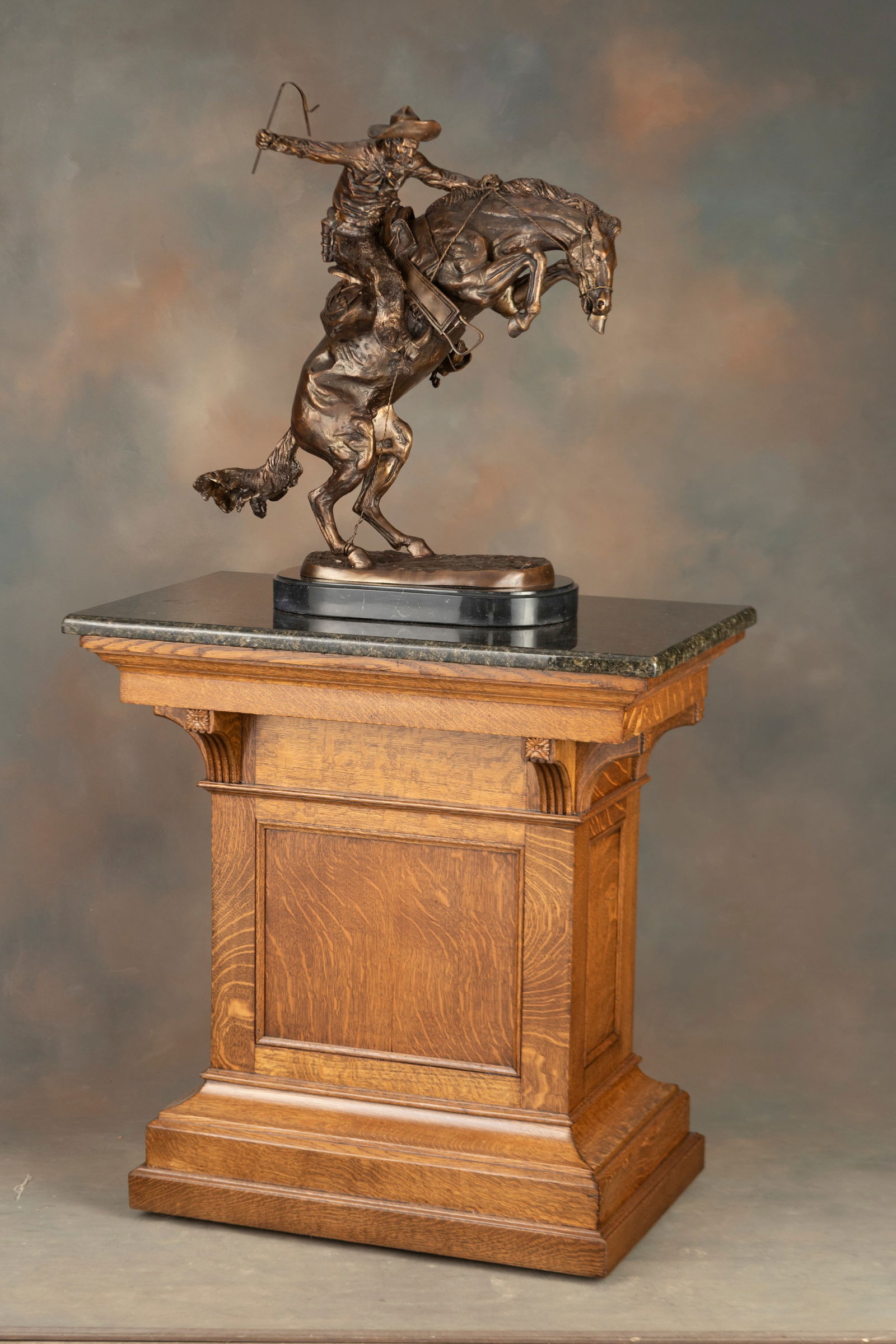 Antique quarter sawn oak Bronze Pedestal, circa 1900. Very fine finish and condition, finished on: Antique quarter sawn oak Bronze Pedestal, circa 1900. Very fine finish and condition, finished on all four sides, measures 38 3/4" T with 37" x 22" granite top. Unique locking door rear storage, with