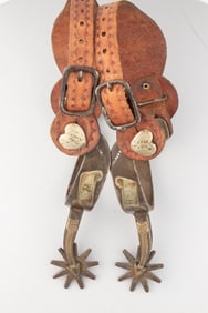 Pair of "Kelly Bros. & Parker" marked single mounted Spurs with the maker mark spelled out, arrow