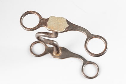 "KB&P" marked silver mounted Bit, #35, with engraved silver shields on cheek piece. Maples Estate.