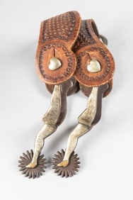 McChesney, double mounted, engraved full silver mounted gal-leg Spurs, with fixed heart buttons,