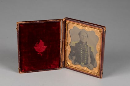 Large cased Tin Type, embossed gold matte, of an early Military Officer holding a sword. Case