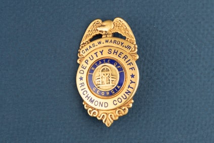 Small gold vintage Shield shaped Badge with Eagle Crest top marked “CHAS. W. WARDY, JR./ DEPUTY