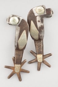 Pair of "Kelly Bros." marked double mounted Spurs, #18, with engraved fixed buttons. Maples Estate.