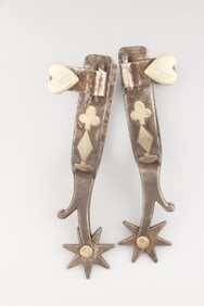 Pair of "Kelly Bros." marked single mounted Spurs with card suit pattern, with chap guards and