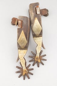 Pair of "K.B.& P." marked double mounted gal-leg Spurs with chap guards, engraved heart buttons and