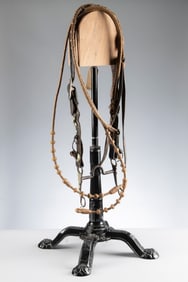 A vintage leather Bridle with silver raised bull heads on cheek piece, mounted with a "Kelly Bros."