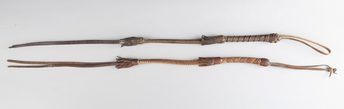 Pair of near matching vintage braided leather Quirts. Sold as one lot. Holley Estate.