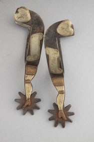 Pair of "Kelly Bros. & Parker", spelled out, single mounted gal-leg Spurs with silver overlaid