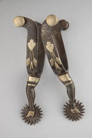 Early pair of McChesney double mounted gal-leg Spurs with leaf and vine overlaid on heel bands.