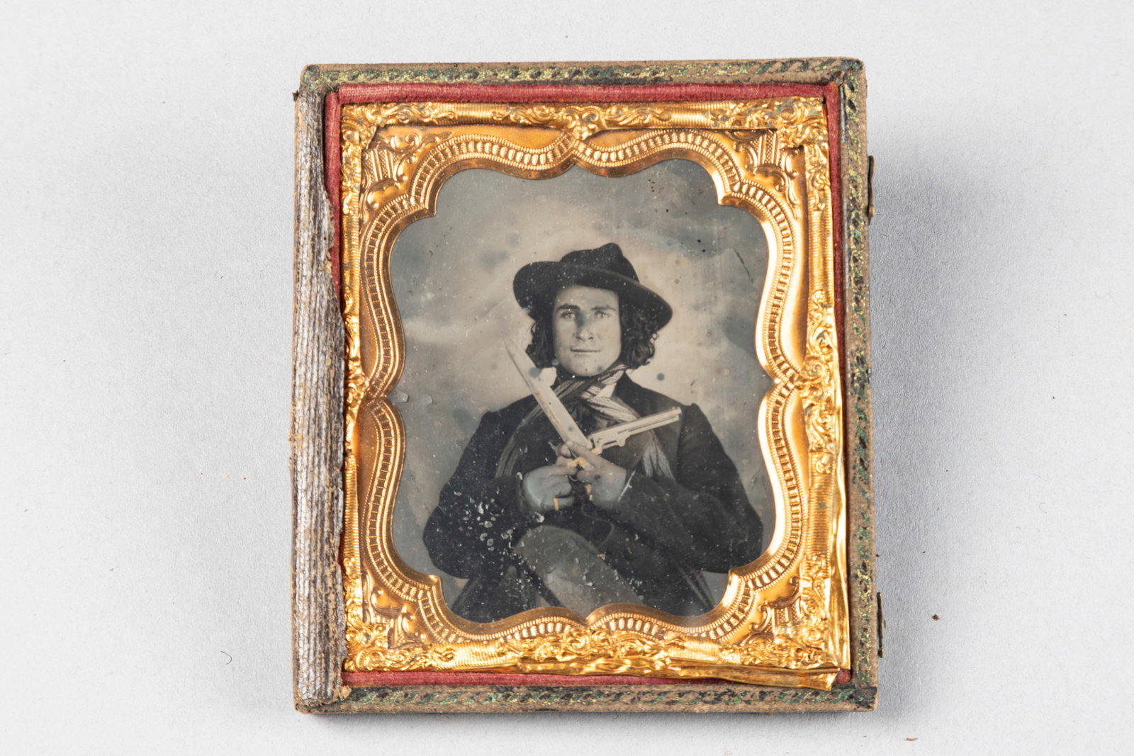 Cased Civil War Tin Type of soldier with slouch hat, more than likely Confederate holding a 51 Navy: Cased Civil War Tin Type of soldier with slouch hat, more than likely Confederate holding a 51 Navy similar to previous lot and a large Bowie Knife. Note on back "Blake Walley/1861". Measures 3 1/4" x