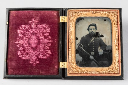 Cased Civil War Period Daguerreotype with soldier holding a sword in sheath. Note case is embossed