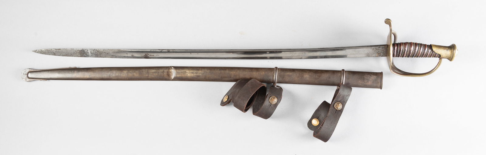 Vintage Sword with brass D-guard handle, no maker marks visible, 30 1/2" blade with blood groove.: Vintage Sword with brass D-guard handle, no maker marks visible, 30 1/2" blade with blood groove. Sold in its original metal sheath with leather carry strap. Strap has brass buttons with 5-point stars