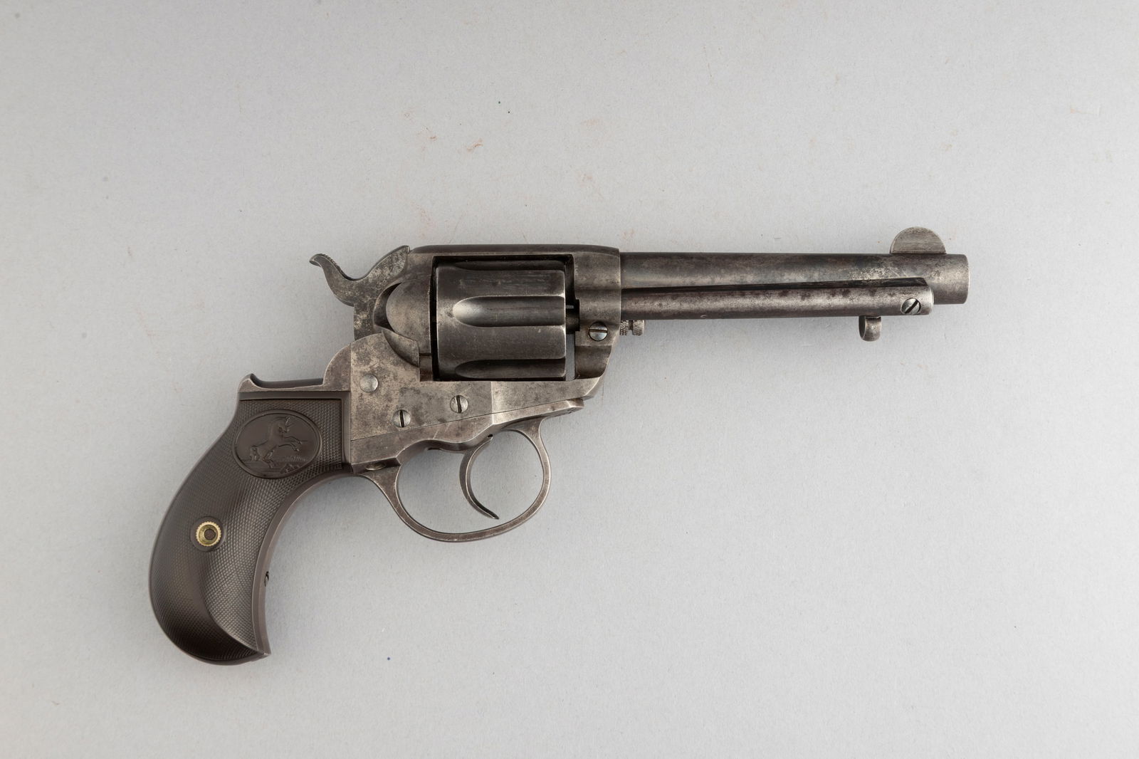 Colt, Model 1877, Double Action Revolver, .38 caliber, SN 113123, manufactured 1899, blue finish: Colt, Model 1877, Double Action Revolver, .38 caliber, SN 113123, manufactured 1899, blue finish with case hardened frame, 4 1/2" barrel, retains some original finish in protected areas, original two-