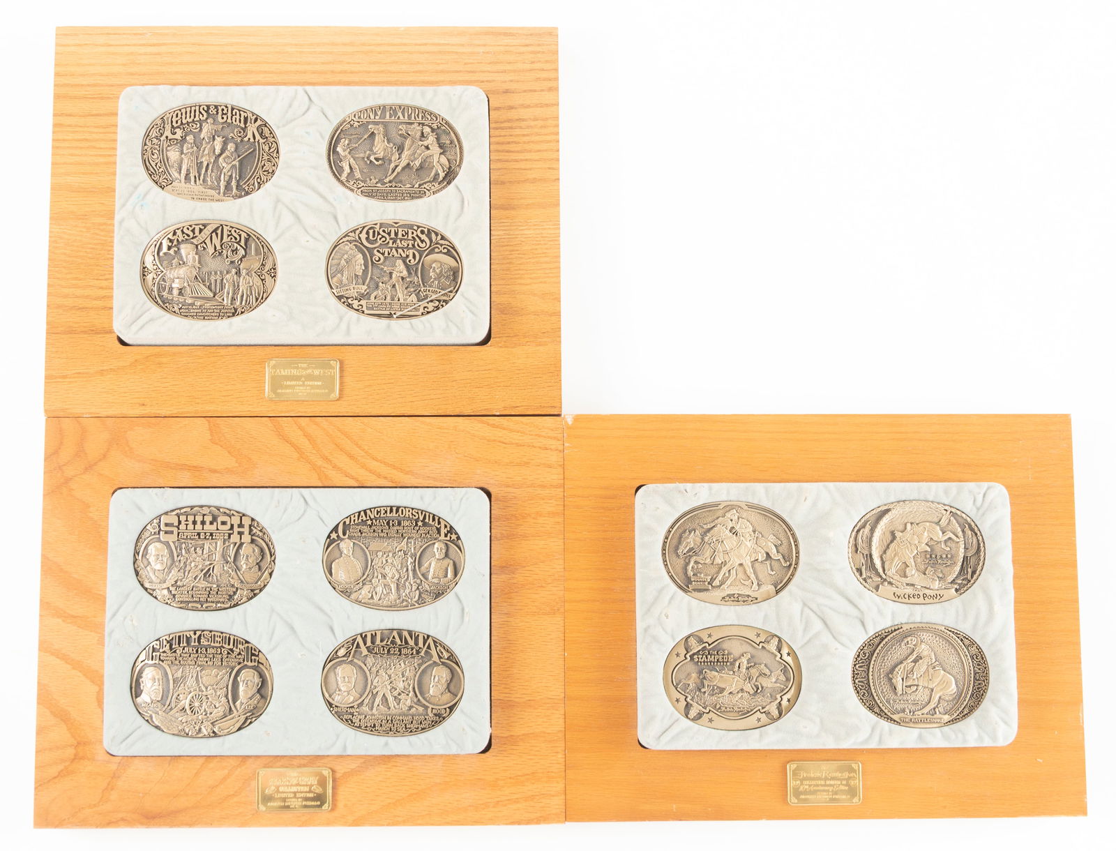 Collection of three wooden Plaques with solid brass Belt Buckles, 4 Buckles to each plaque. Each: Collection of three wooden Plaques with solid brass Belt Buckles, 4 Buckles to each plaque. Each plaque of 4 Buckles are different themes. (1) "The Blue and the Gray Collection Limited Edition" with S