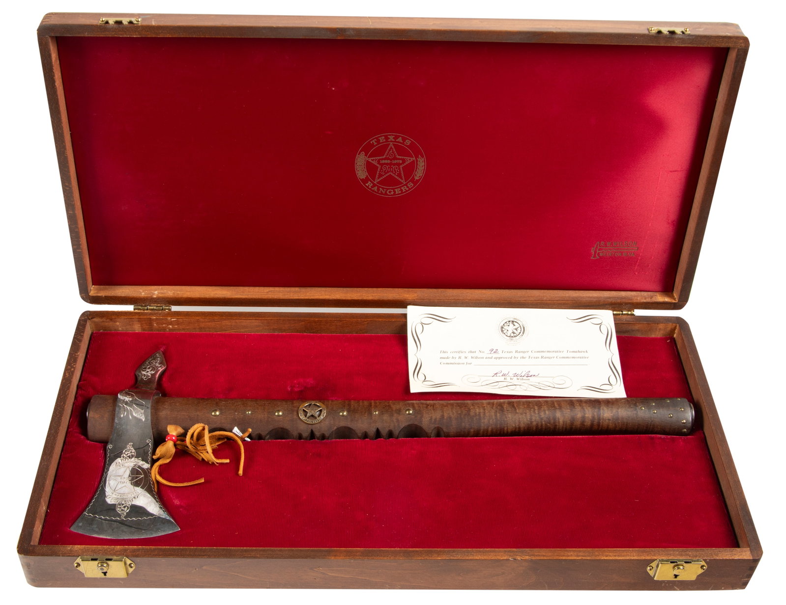 Cased Texas Ranger Commemorative Tomahawk, SN 92, made by R.W. Wilson. Commemorating the Texas: Cased Texas Ranger Commemorative Tomahawk, SN 92, made by R.W. Wilson. Commemorating the Texas Rangers from 1823-1973, beautifully engraved silver plated Axe Head measures 7 1/2" long, with 18 1/2" ha