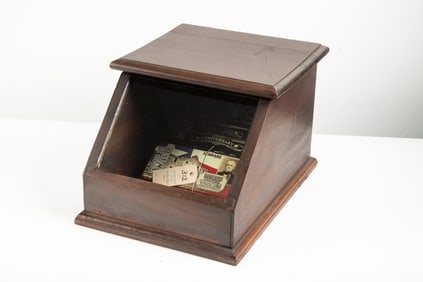 Vintage small wooden and glass slant front, hinged lift top Showcase, counter top model, in original