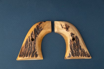 Pair of two-piece Stag Grips for a Colt SAA Revolver.