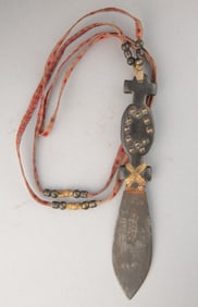 Spotted Buffalo Horn Handled Side Knife with early leather neck strap. It has a beaver tail shaped