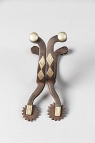 Pair of early McChesney double mounted Spurs, #14, with fixed etched buttons. Maples Estate.