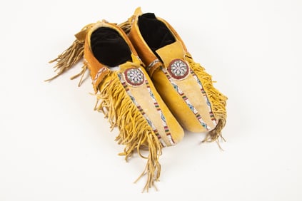 Wild West style beaded and fringed pair of Moccasins showing wear but in overall very good
