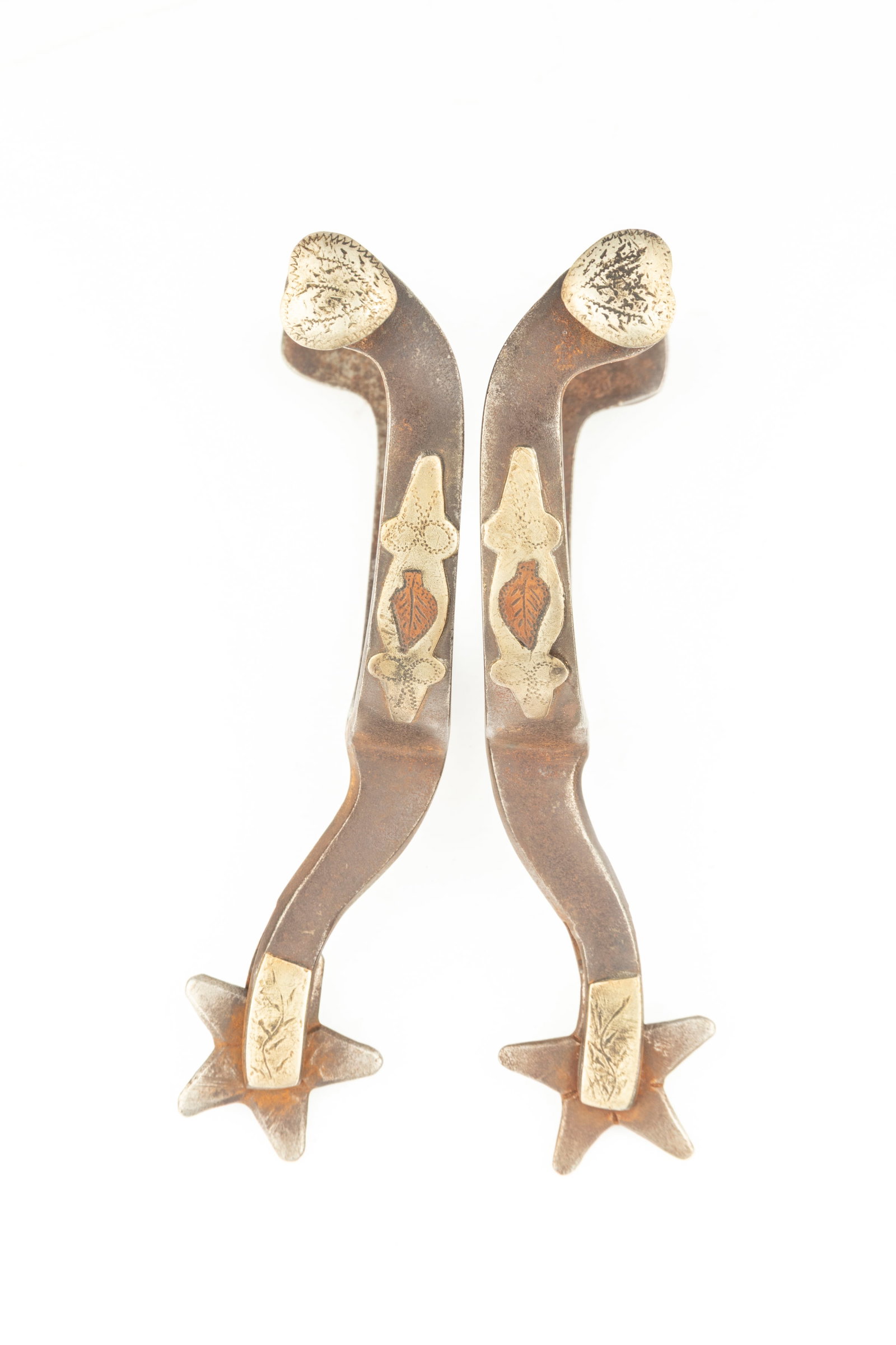 Pair of McChesney single mounted Spurs with etched silver heart buttons. Maples Estate.: Pair of McChesney single mounted Spurs with etched silver heart buttons. Maples Estate.