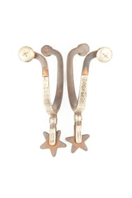 Pair of McChesney single mounted Spurs, #1, with etched fixed buttons. Maples Estate.