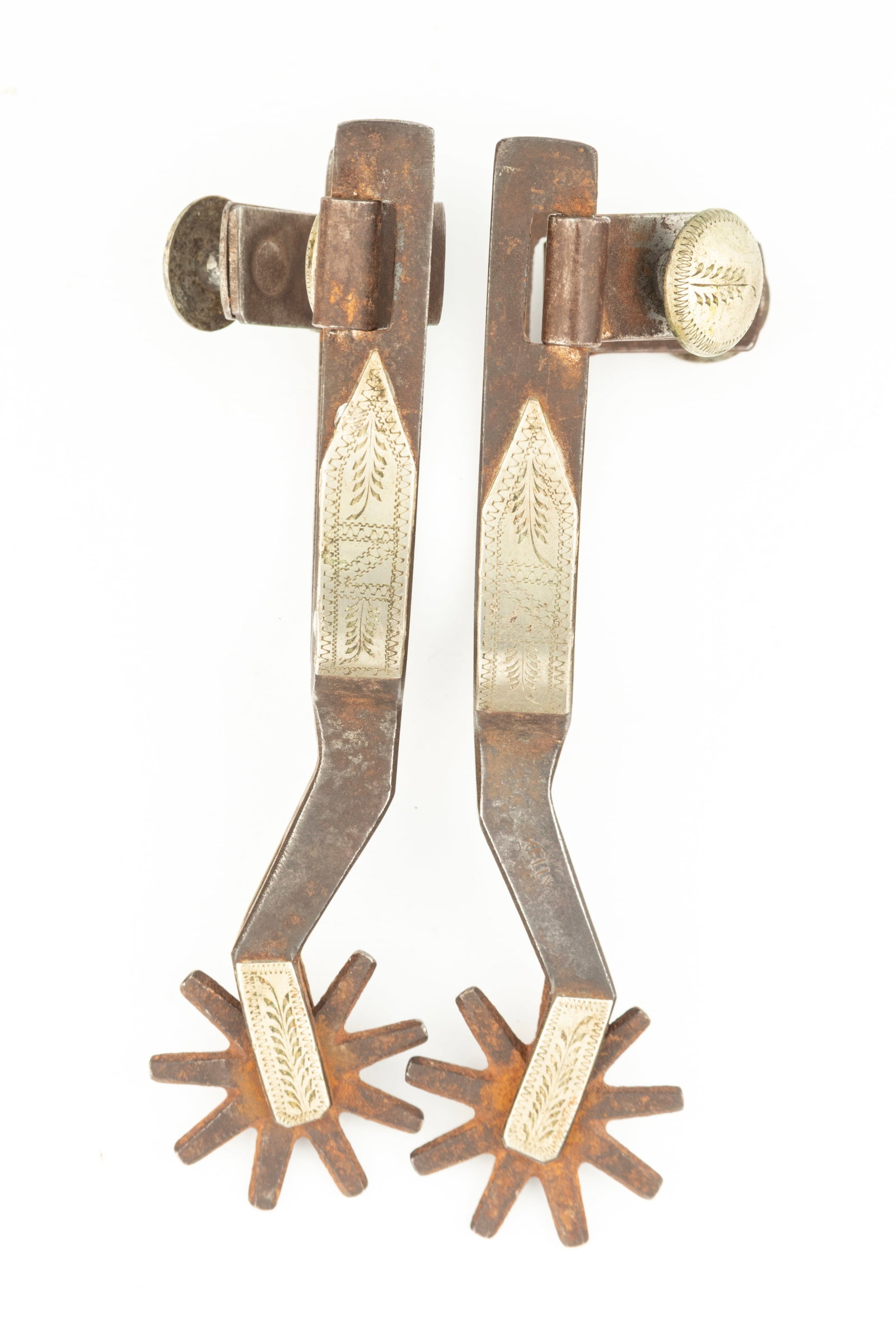 Pair of "Kelly Bros." marked double mounted Spurs, #56, with etched swing buttons. Maples Estate: Pair of "Kelly Bros." marked double mounted Spurs, #56, with etched swing buttons. Maples Estate