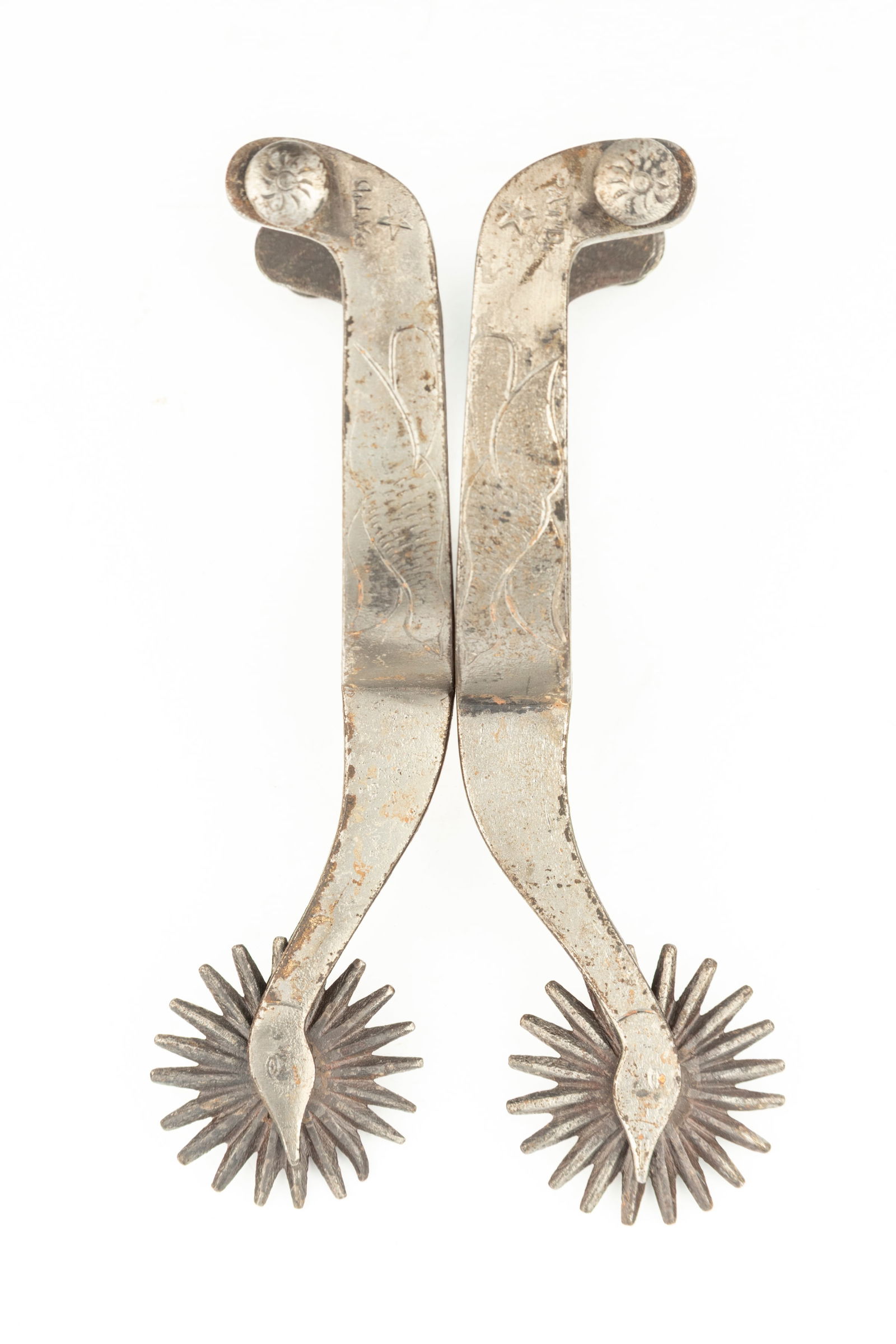 Pair of "Star" marked August Buermann Goose Head Spurs, #3312, with engraved flying goose on heel: Pair of "Star" marked August Buermann Goose Head Spurs, #3312, with engraved flying goose on heel bands, appear to have a light coat of gray paint. Maples Estate.