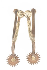 Pair of McChesney single mounted Spurs with etched fixed buttons. Maples Estate.