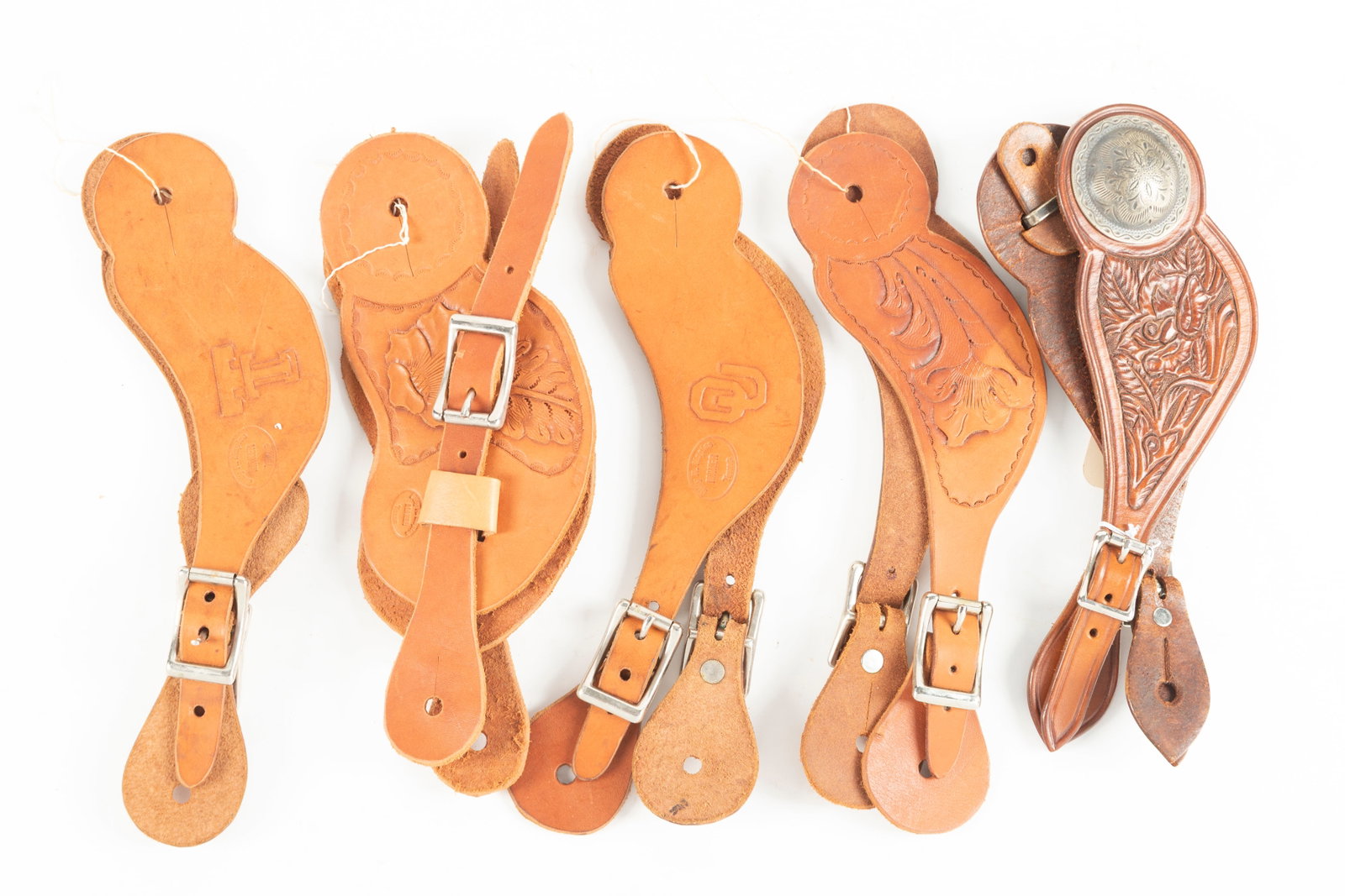Collection of five matching pairs of two-piece Spur Straps. Will be sold as a collection. Maples: Collection of five matching pairs of two-piece Spur Straps. Will be sold as a collection. Maples Estate.