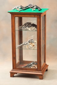 Fancy custom built, quarter sawn oak and glass, floor model Showcase on footed base with rope twist