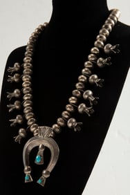 Beautiful silver Squash Blossom Necklace with silver beads and horseshoe shaped Naja with turquoise