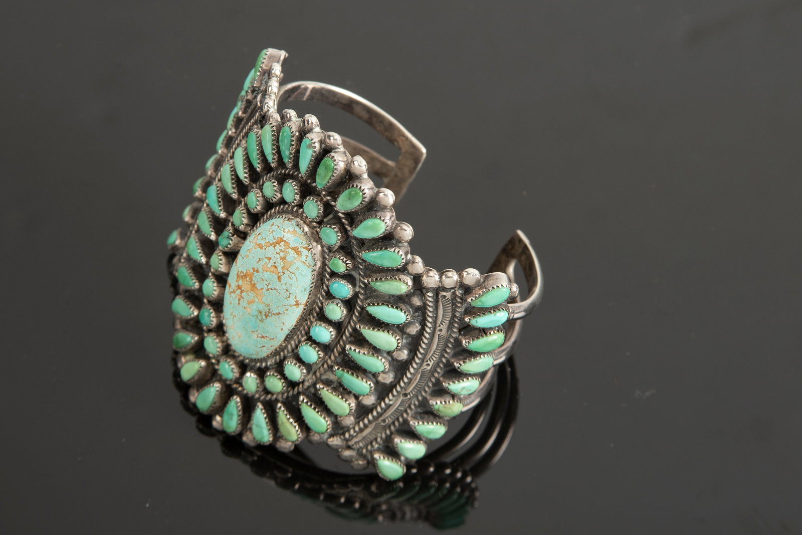 Fantastic silver Petit Point turquoise Cuff with maker mark "F.M.D.". The Zuni Indians started this: Fantastic silver Petit Point turquoise Cuff with maker mark "F.M.D.". The Zuni Indians started this style jewelry in the 1920s.