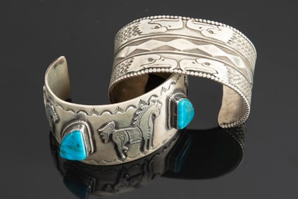 Two heavy "Sterling" marked Navajo Cuffs. One has horses and large turquoise stones, marked "RV" in