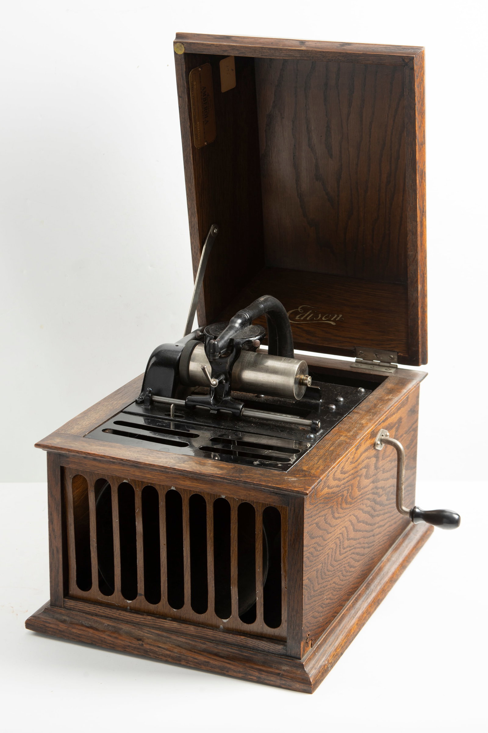 Antique Edison Ambrola, oak case, cylinder player, in playing order. Case is in original finish and: Antique Edison Ambrola, oak case, cylinder player, in playing order. Case is in original finish and sells with two cylinders. Measures 12 1/2" W x 16" L x 13" T.