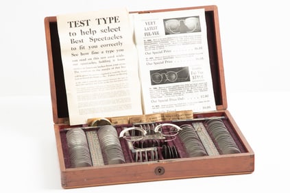 Vintage wooden Lens Case with Testing Spectacles and many Lenses, accompanied by paperwork. Case
