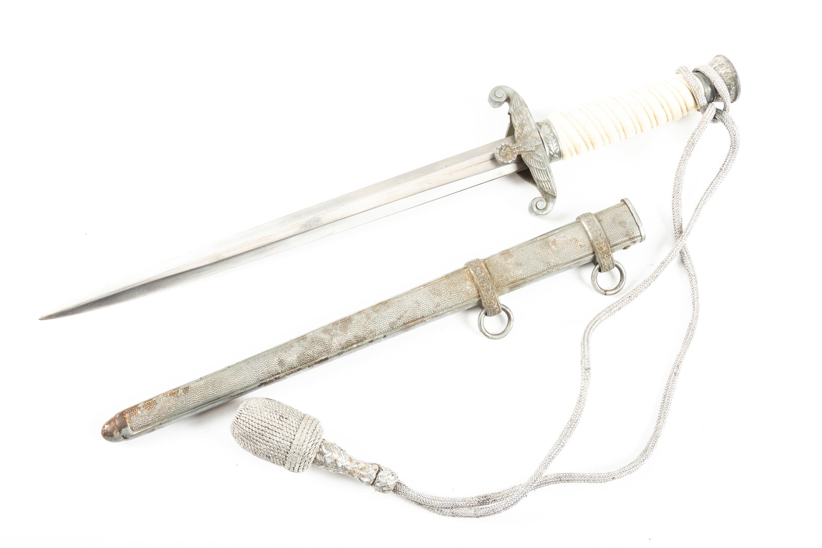 German Luftwaffe Airforce Officers Dagger, no maker mark visible, original sheath. Dagger has winged: German Luftwaffe Airforce Officers Dagger, no maker mark visible, original sheath. Dagger has winged eagle cross guard holding Swastika. Overall very good condition, scabbard shows some discoloring an