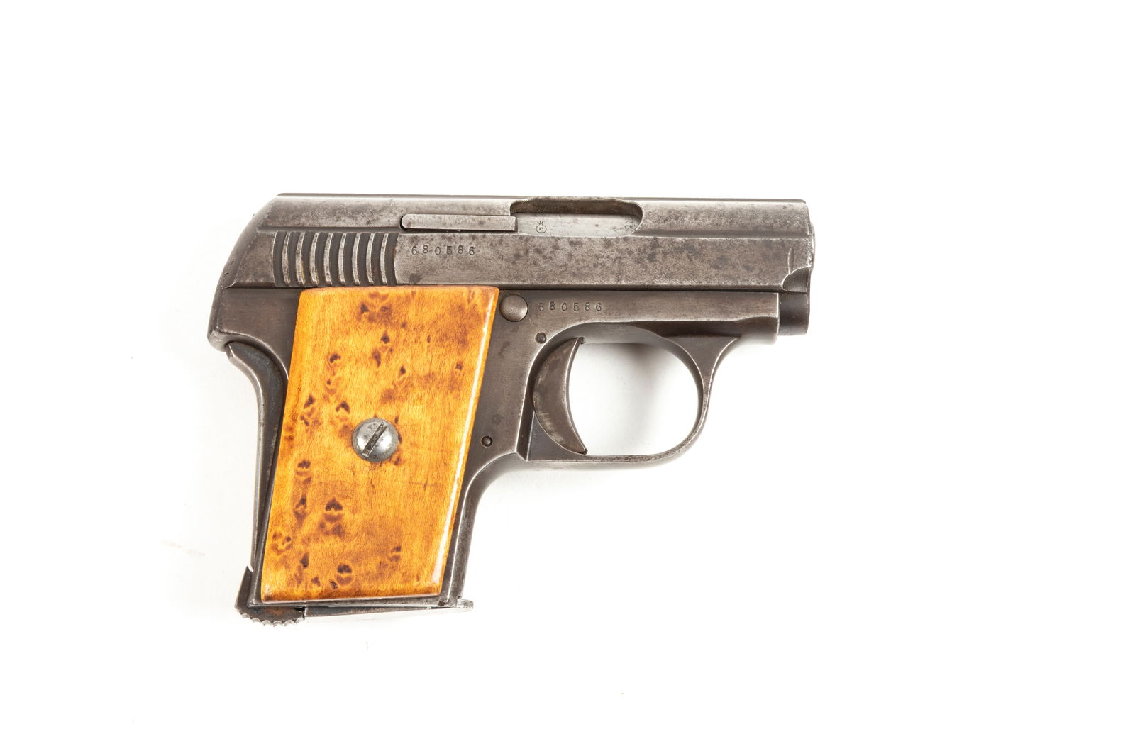 Astra, Semi-Auto, Vest Pocket Pistol, .6.35/25 caliber, SN 680586, metal is dark gray to brown aged: Astra, Semi-Auto, Vest Pocket Pistol, .6.35/25 caliber, SN 680586, metal is dark gray to brown aged patina, 2 1/2" barrel, custom birds eye maple grips, mechanically sound, bright bore. (Modern)