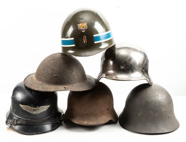 Collection of Six (6) WWI & WWII U.S. and German Helmets. One German Helmet is marked "Luftschutt"