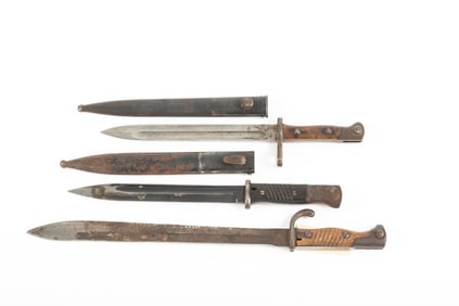 Collection of three Military Bayonets to include: Two with sheaths. One has 14 1/4" blade, two have