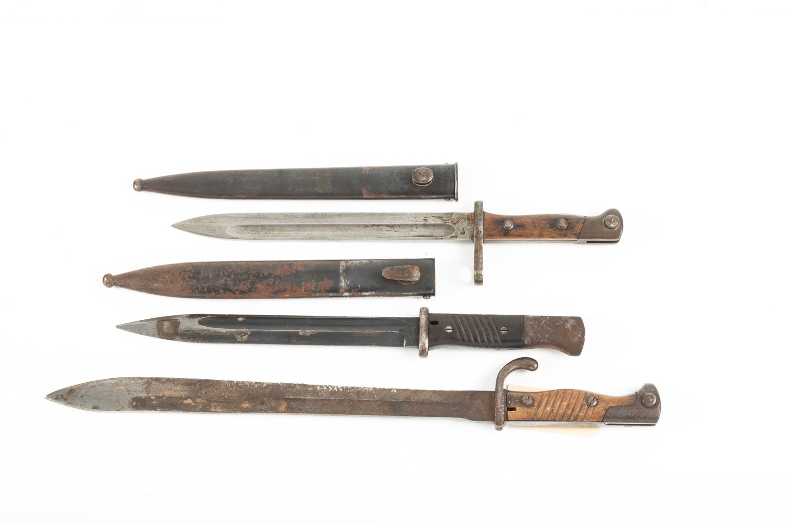 Collection of three Military Bayonets to include: Two with sheaths. One has 14 1/4" blade, two have: Collection of three Military Bayonets to include: Two with sheaths. One has 14 1/4" blade, two have 9 3/4" blades. Will be sold as one lot.