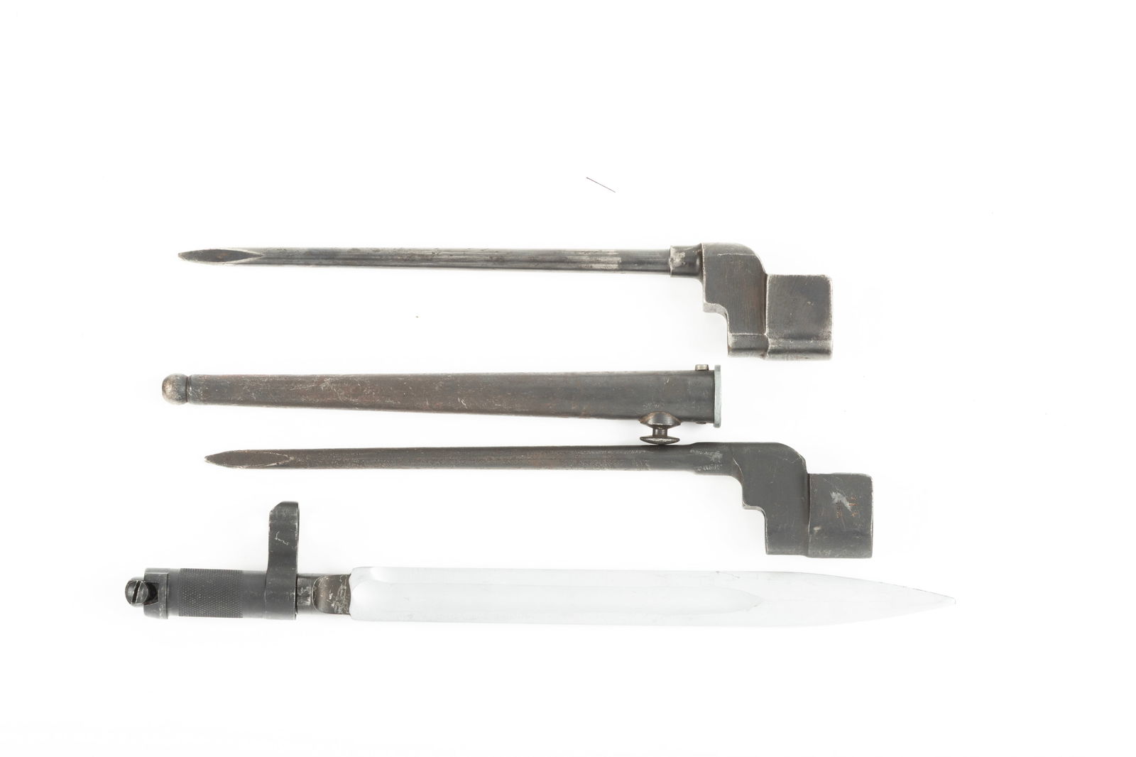 Collection of three Spike Military Bayonets to include: Two are British No. 4 Spike, one with sheath: Collection of three Spike Military Bayonets to include: Two are British No. 4 Spike, one with sheath and 8" blade. One with 8" blade. One with a 9" blade, believed to be a Russian SKS Spike bayonet. W