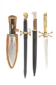 Collection of four Collector's Knives. One with skull & cross bones with 8" blade, no sheath. One