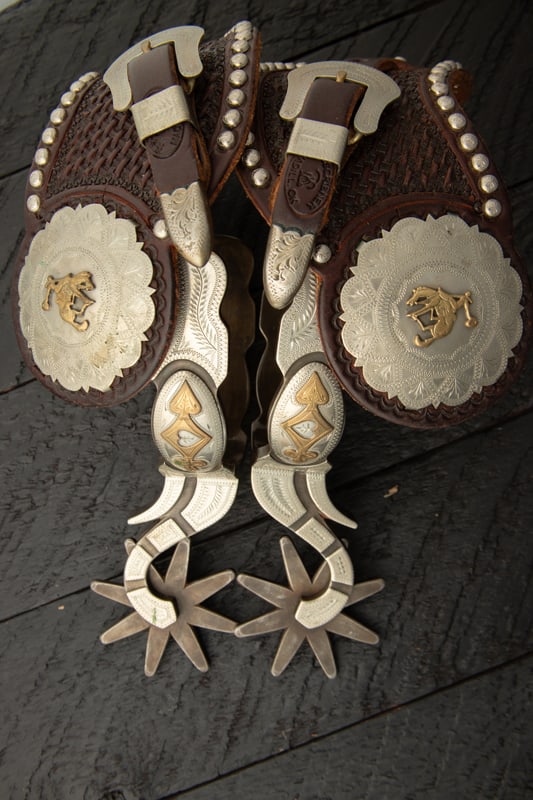 Pair of "Jerry Wallace" marked Spurs, Buckaroo style with hand engraved silver overlay, raised (1 of 2)
