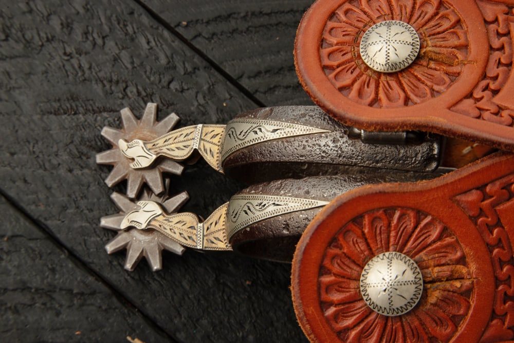 Pair of "Henry Ellis" marked double mounted gal-leg Spurs, #147, very desirable, beautifully: Pair of "Henry Ellis" marked double mounted gal-leg Spurs, #147, very desirable, beautifully engraved with etched swing buttons. Mounted with a pair of fancy two-piece straps. The late Henry Ellis, Ok