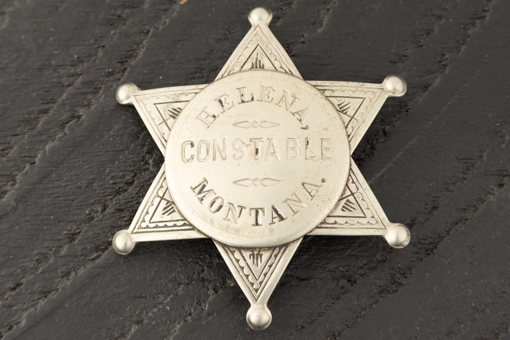 Vintage 6-point ball star Badge marked "HELENA/CONSTABLE/MONTANA", on center disc mounted to the: Vintage 6-point ball star Badge marked "HELENA/CONSTABLE/MONTANA", on center disc mounted to the star. Very attractive Badge with saddle pin and catch intact, measures 2 1/4" T x 2 1/4" W. Estimate $4