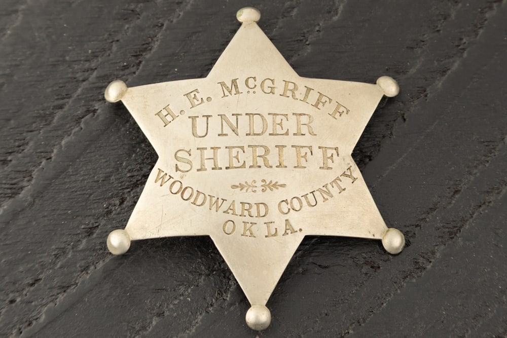 Vintage "H.E. McGriff/UNDER SHERIFF/WOODWARD COUNTY/OKLA." marked 6-point ball star Badge. All the (1 of 2)