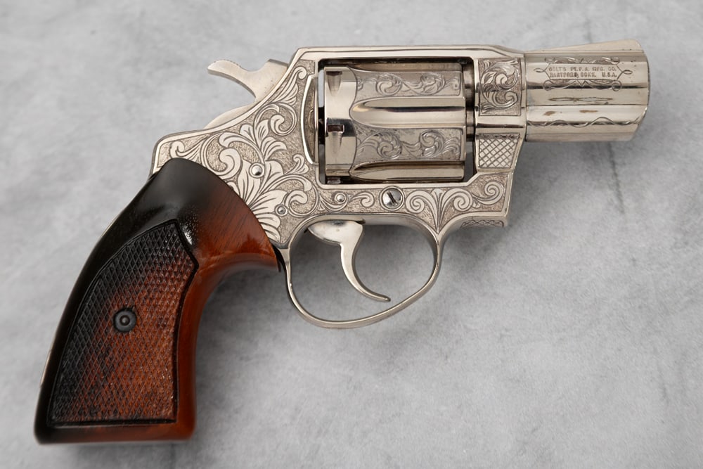 Engraved Colt Revolver, Detective Special, SN M48222 in .38 Spl. caliber. It is accompanied by a (1 of 3)