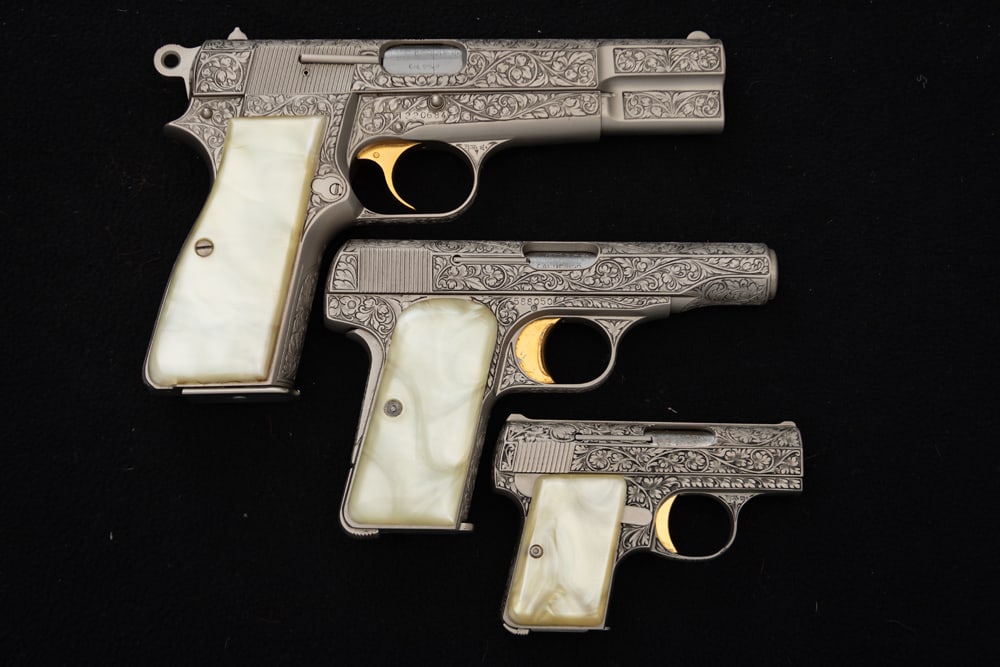 Browning Three Piece Renaissance Set of engraved Semi-Auto Pistols, all profusely engraved and a: Browning Three Piece Renaissance Set of engraved Semi-Auto Pistols, all profusely engraved and a complete matched set. (1) Browning Semi-Auto, 9 MM caliber Pistol, SN 220684, 5" barrel with gold trigg