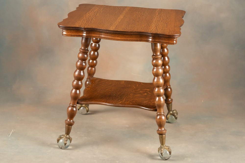Beautiful antique quarter sawn oak Lamp Table, circa 1900, with very desirable Tiffany type ball &: Beautiful antique quarter sawn oak Lamp Table, circa 1900, with very desirable Tiffany type ball & claw feet, excellent finish and condition, measures 30" T x 27" serpentine top and fancy stretcher.